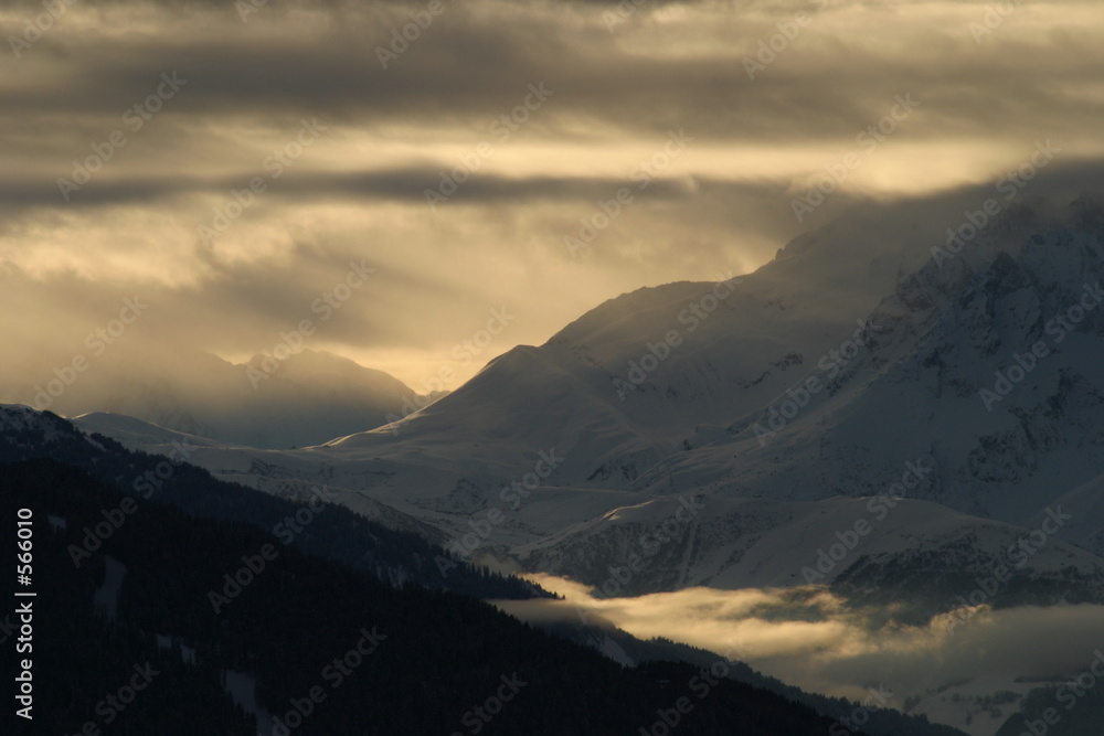 golden sunset over an alpine valley