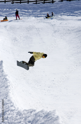 snowboarder on half pipe of ski resort in spain