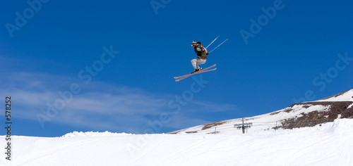 man skiing on slopes of ski resort in spain