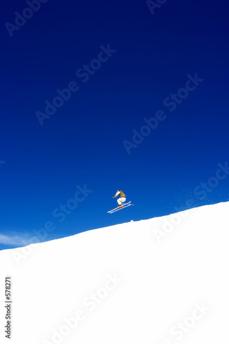 man skiing on slopes of ski resort in spain