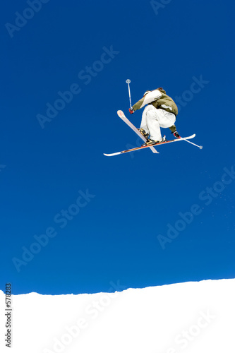 man skiing on slopes of ski resort in spain