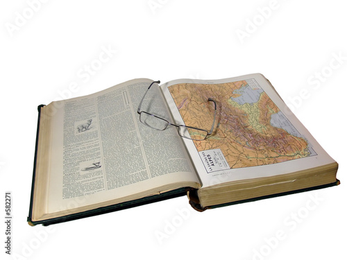glasses on open map page