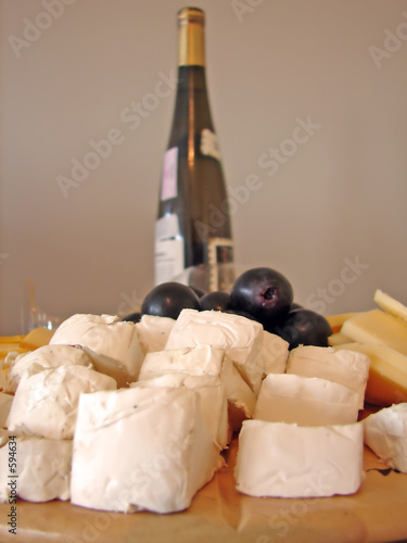 cheeses plate and bottle of wine