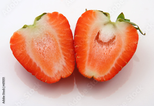 two halves of a strawberry