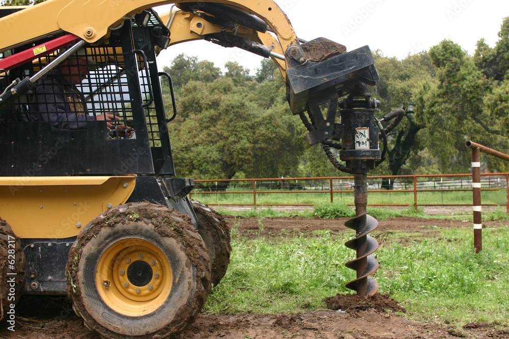 Φωτογραφία post holes with the bobcat