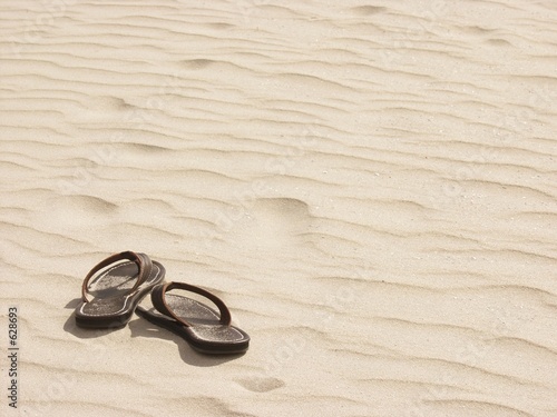 sandals, alone on the beach