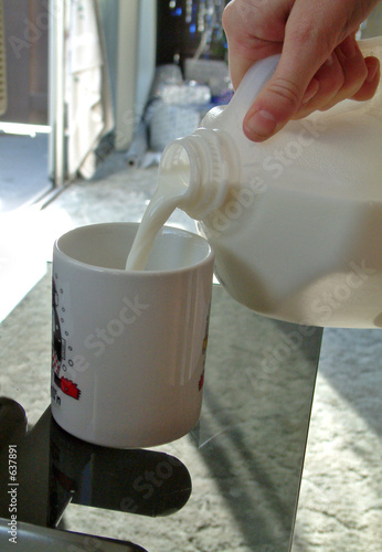 pouring a glass of milk