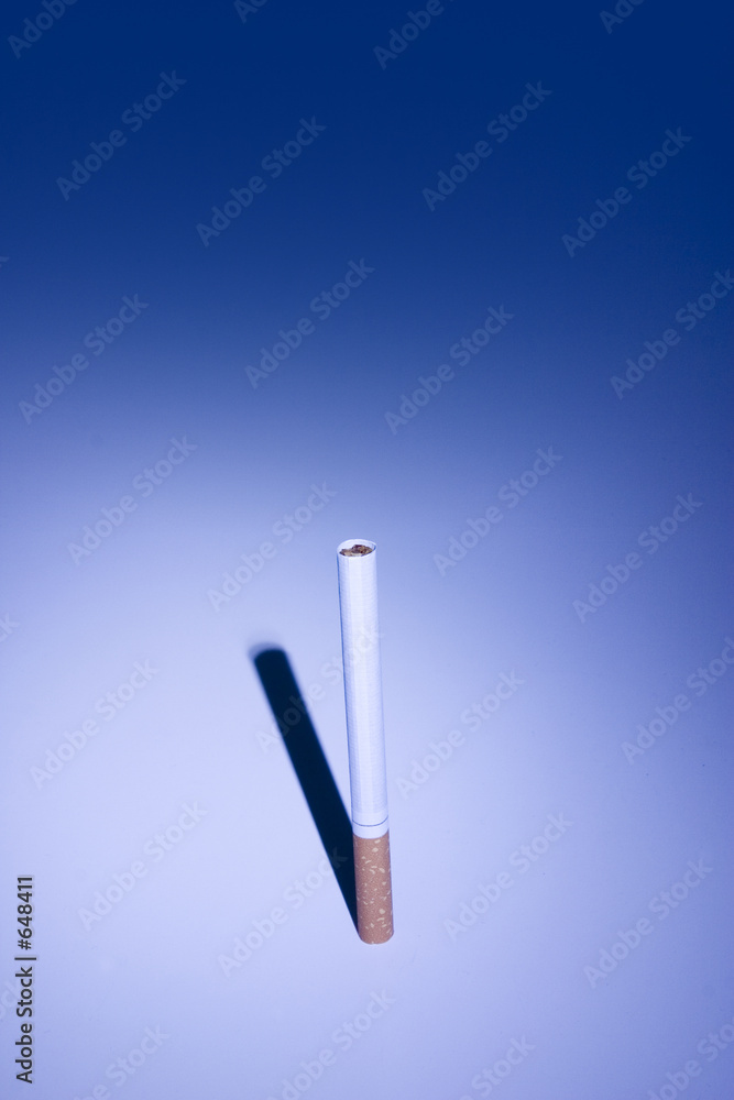 isolated cigarette under blue light isolated cigarette under blue light