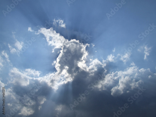 white clouds and sun beams