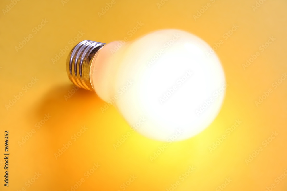 illuminated lightbulb on yellow background illuminated lightbulb on yellow background