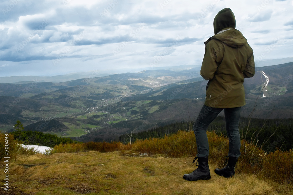 girl tourist at the top of summit