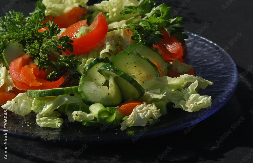 green salad on a glass plate green salad on a glass plate