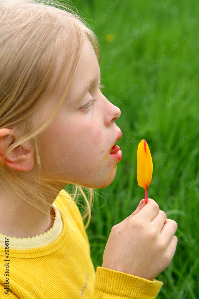 licking yellow ice-cream