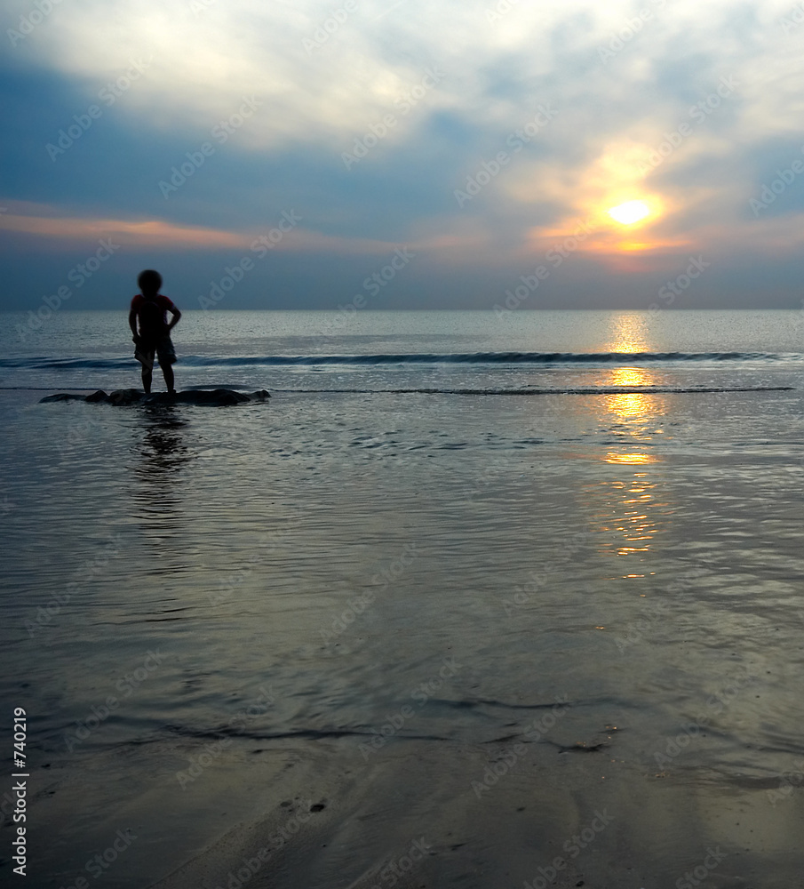 boy playing at the beach