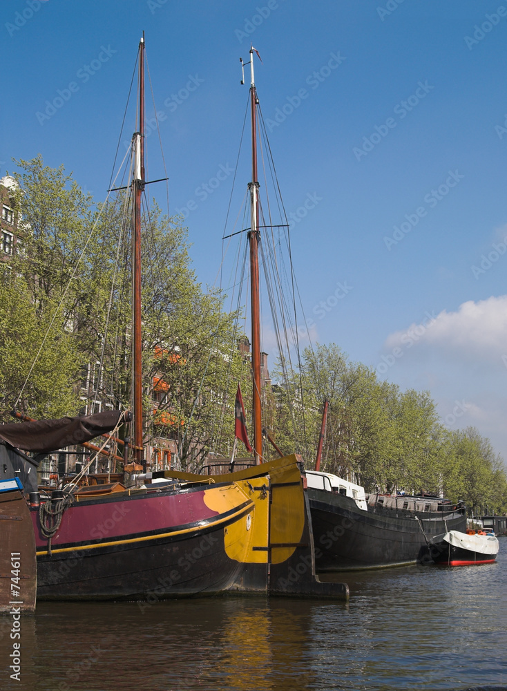 yachts in city canal, amsterdam, netherlands