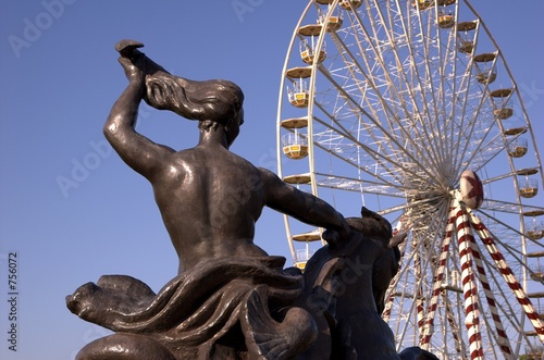 statue and big wheel