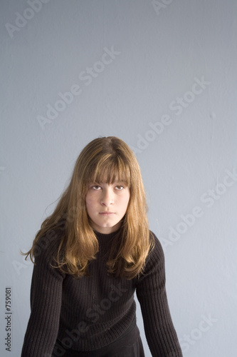 stock photo of a girl against blue wall