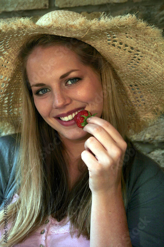 woman with strawberry - healthy eating photo