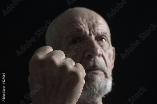 senior with fist
