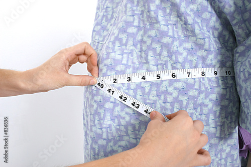 expecting mom's belly being measured
