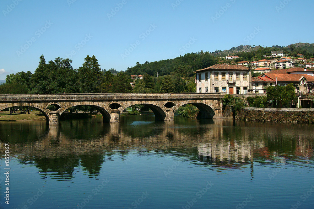 roman bridge reflected in the river