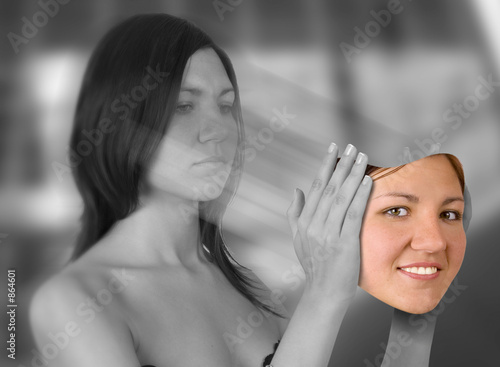 young woman holding smiling face photo