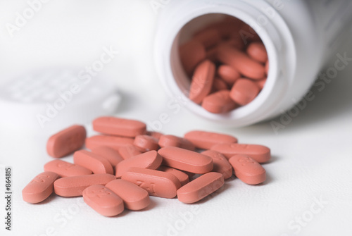 spilled pile of red tablets