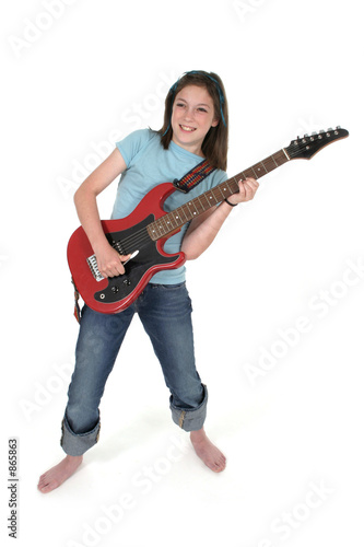 young pre teen girl playing guitar 3