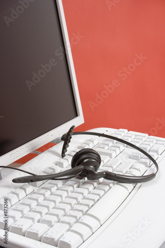 headset on the computer keyboard (red)
