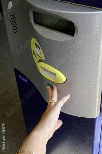 hand waiting on a car park machine