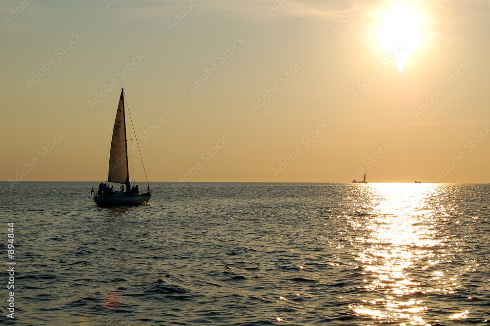 yacht sailing in the sunset