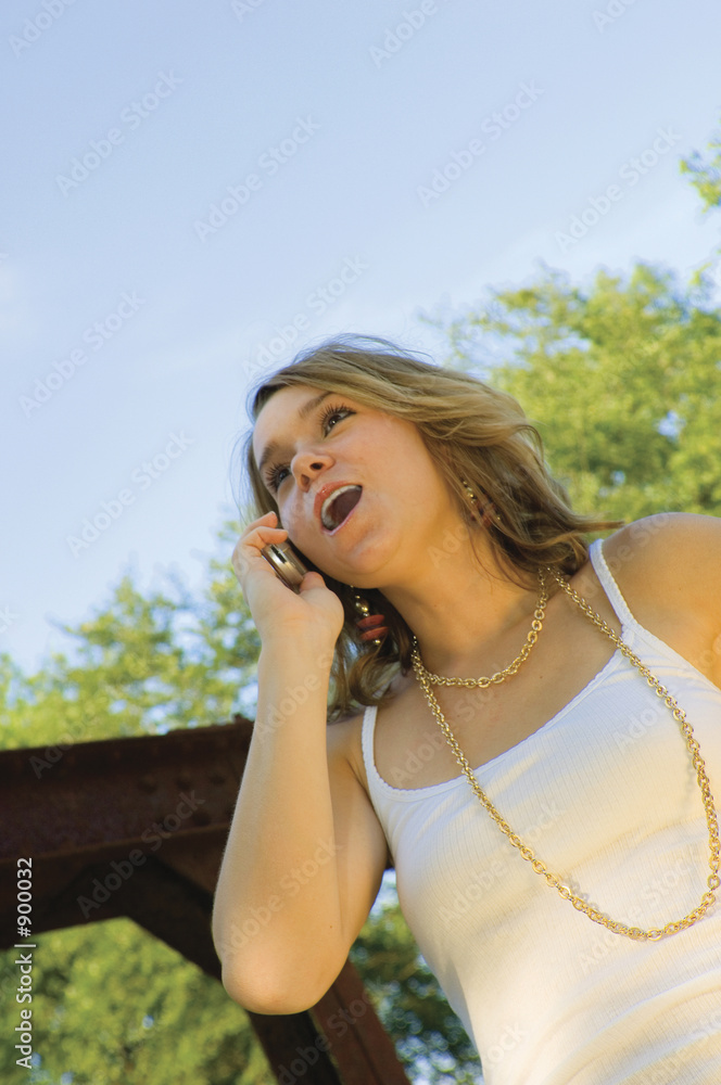pretty teenage girl talking on mobile phone