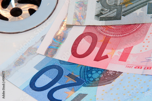 euro banknotes going down the drain