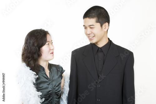 young asian couple dressed up