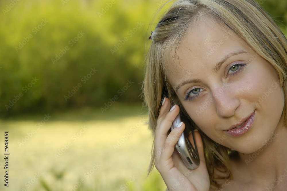 nice girl on the grass-plot with cell phone nice girl on the grass-plot with cell phone