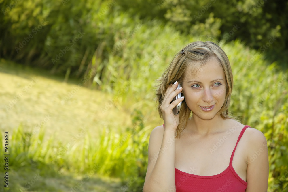 nice girl on the grass-plot with cell phone nice girl on the grass-plot with cell phone