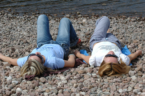 two girls relaxing at the beach