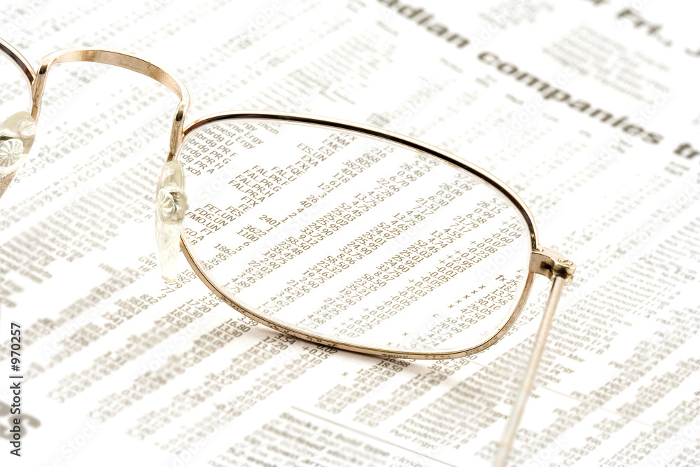 glasses on a newspaper