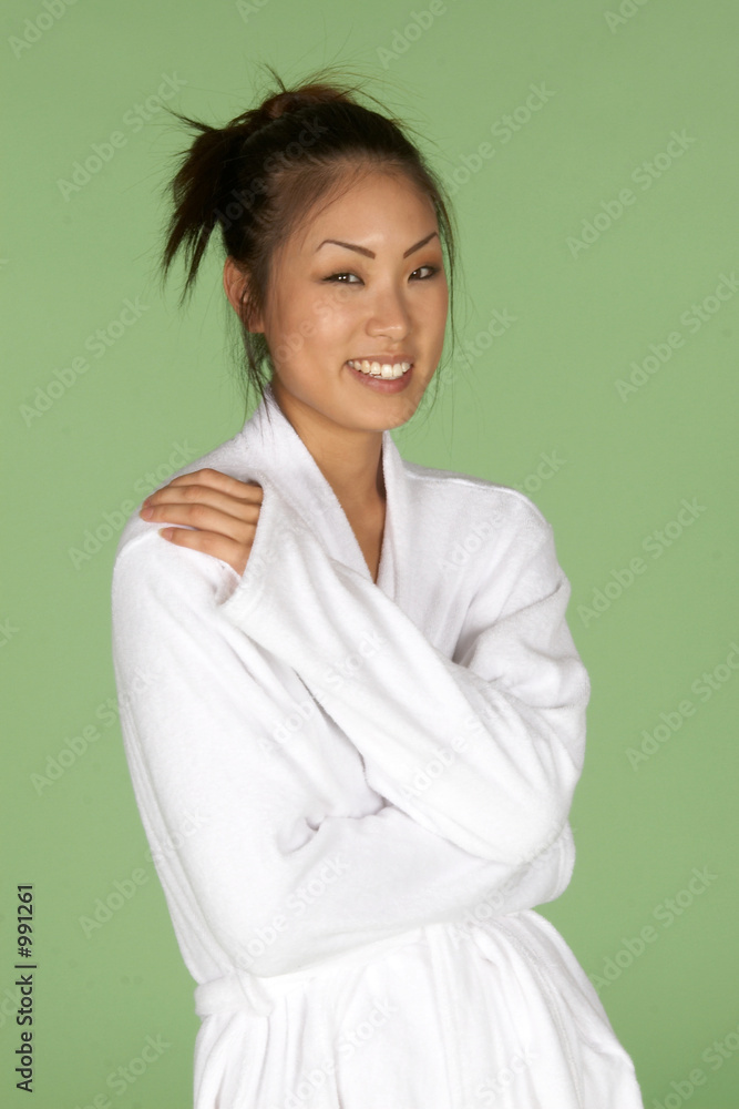 young asian woman in white bath robe young asian woman in white bath robe
