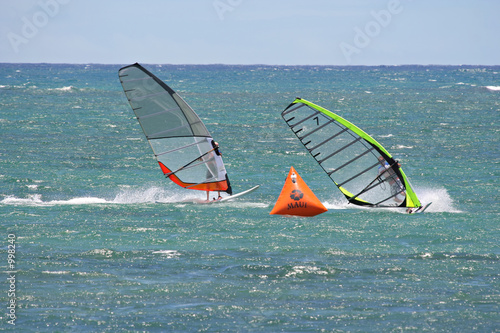 windsurfers in tight race around ocean buoy