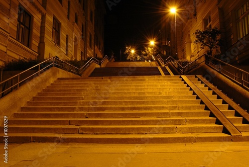 stairway in the light of street lamps