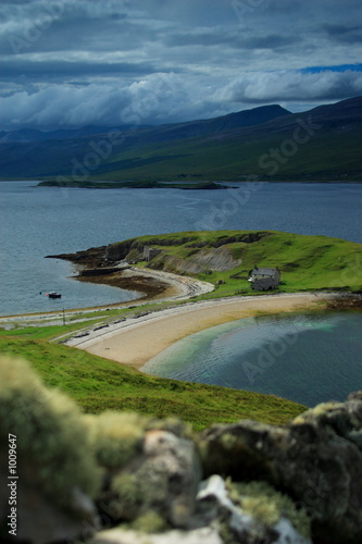 scottish loch and beach with out of focus wall