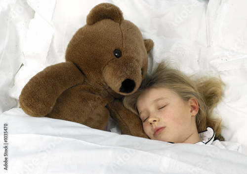sleeping girl with big teddy bear