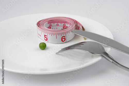pea and measuring tape on a plate