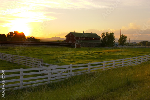 countryside fence leading to a ranch