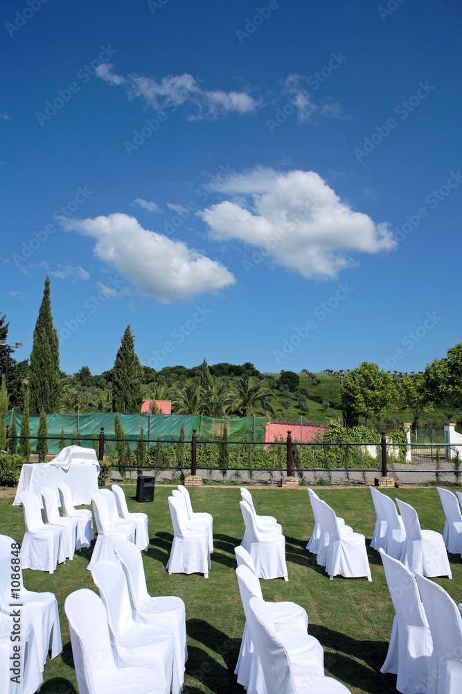 empty seats at an outdoor wedding