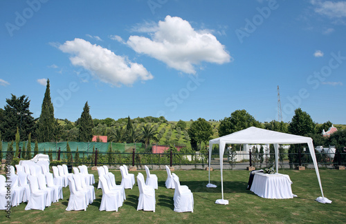 empty seats at an outdoor wedding