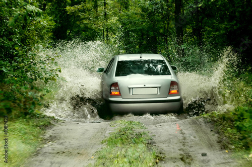rally car splashing the water © Piotr Sikora