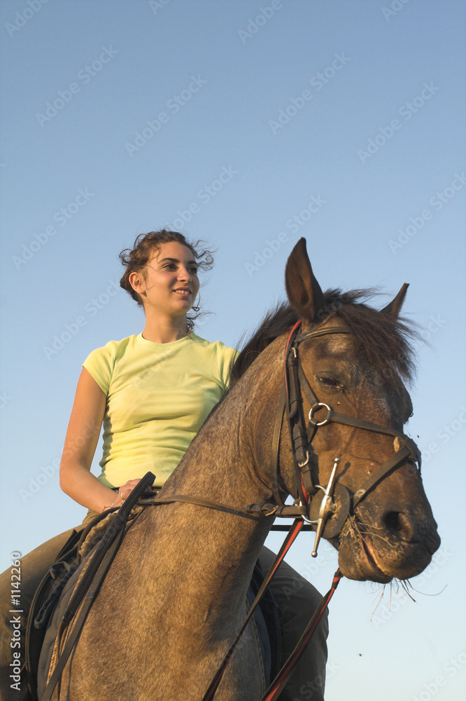 Fototapeta premium girl riding a horse