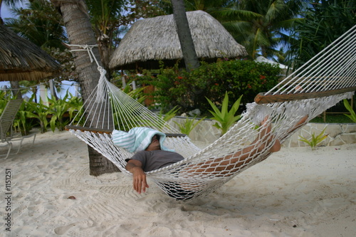 man resting on hammock